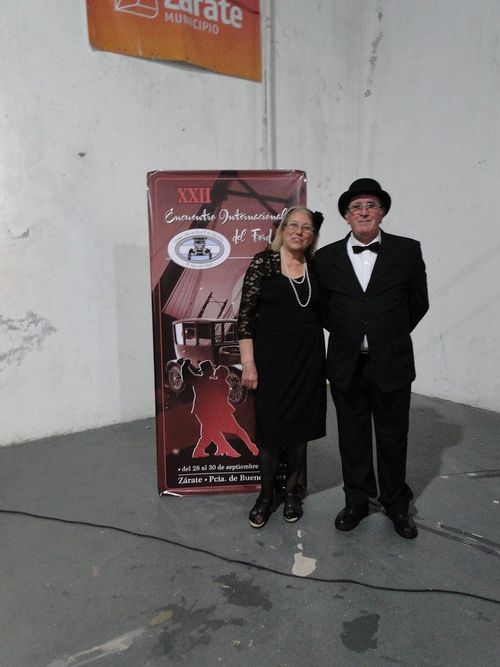 La cena de gala, junto al afiche oficial del XXII Encuentro